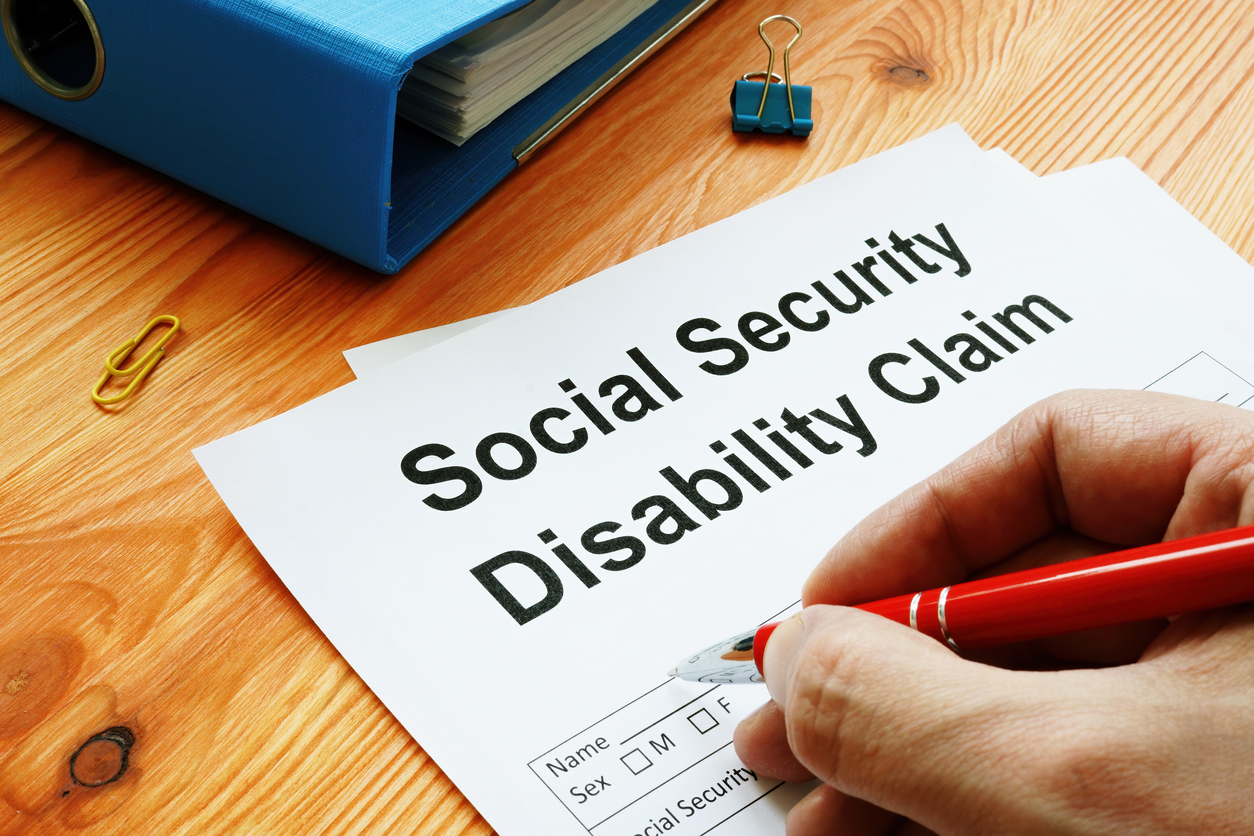 Person filling out social security disability claim